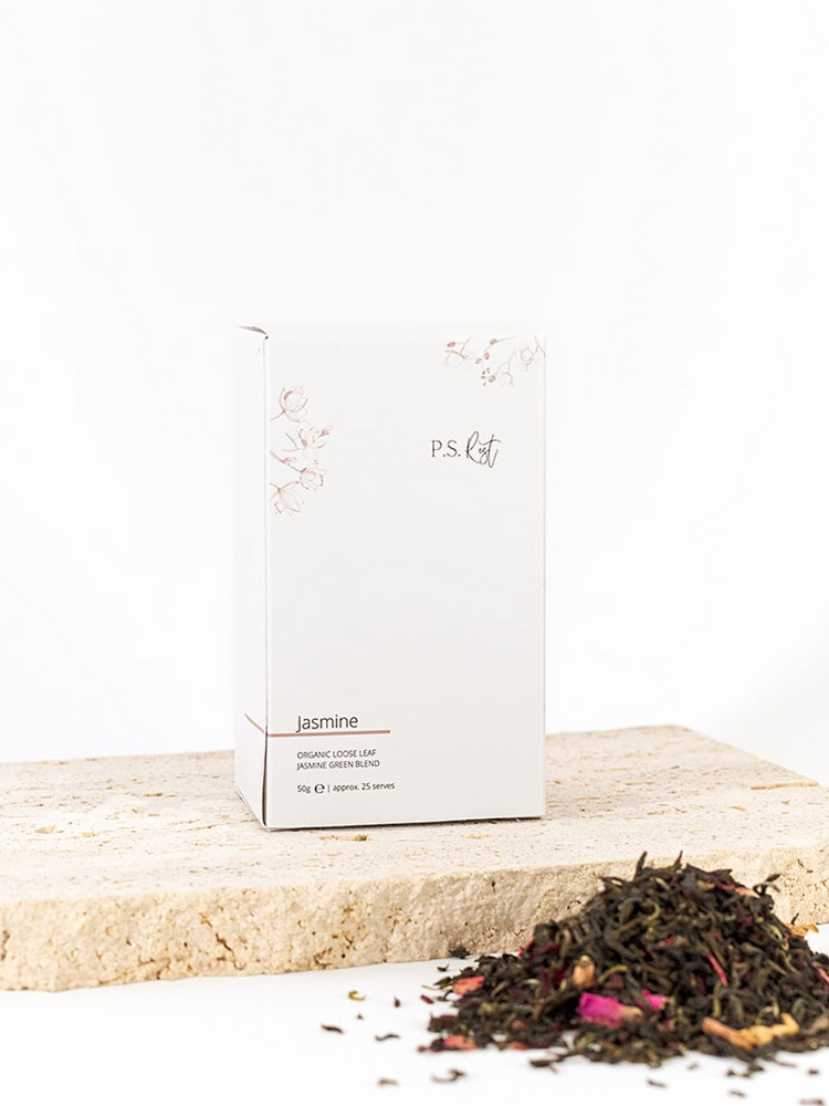 
                  
                    Tea packaging with jasmine tea leaves on a white background
                  
                