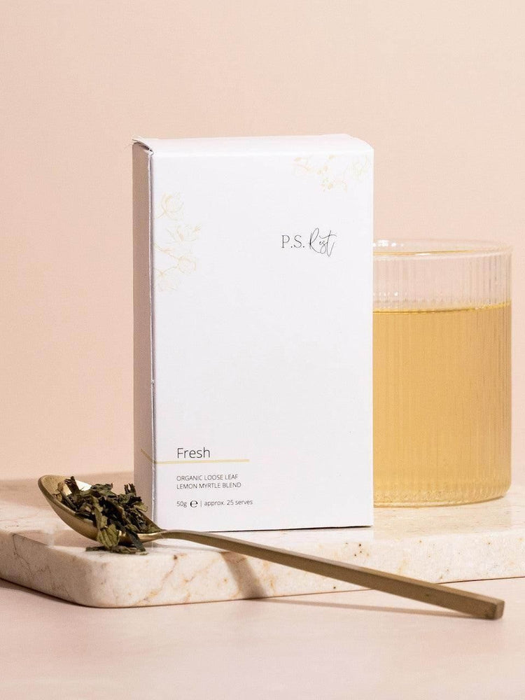 
                  
                    White packaging labeled 'P.S. Tea' with a gold spoon and tea leaves on a light background
                  
                
