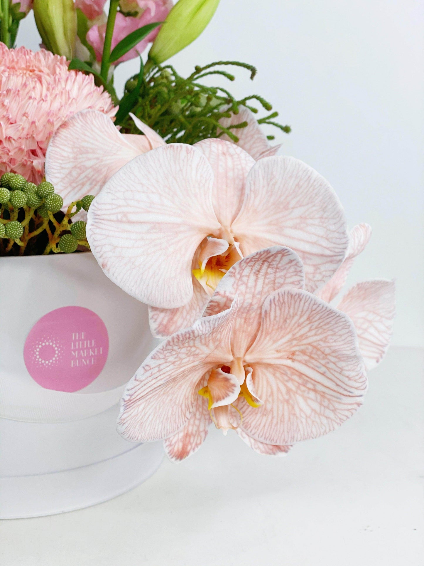 
                  
                    Phalaenopsis Orchids Hat Box shot by The Little Market Bunch in Melbourne.
                  
                